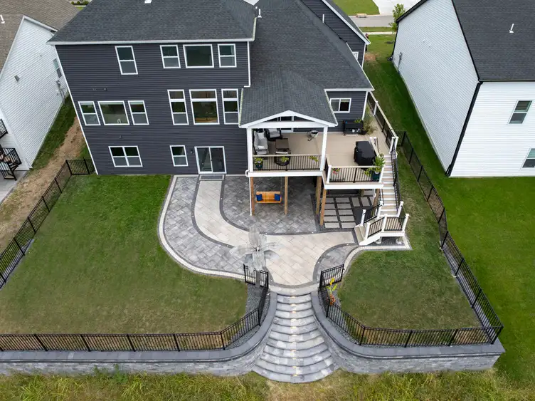 Aerial view of backyard patio with retaining wall in St. Louis