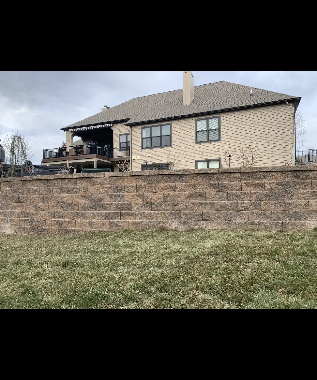 Large retaining wall on hillside property built by Green Operations