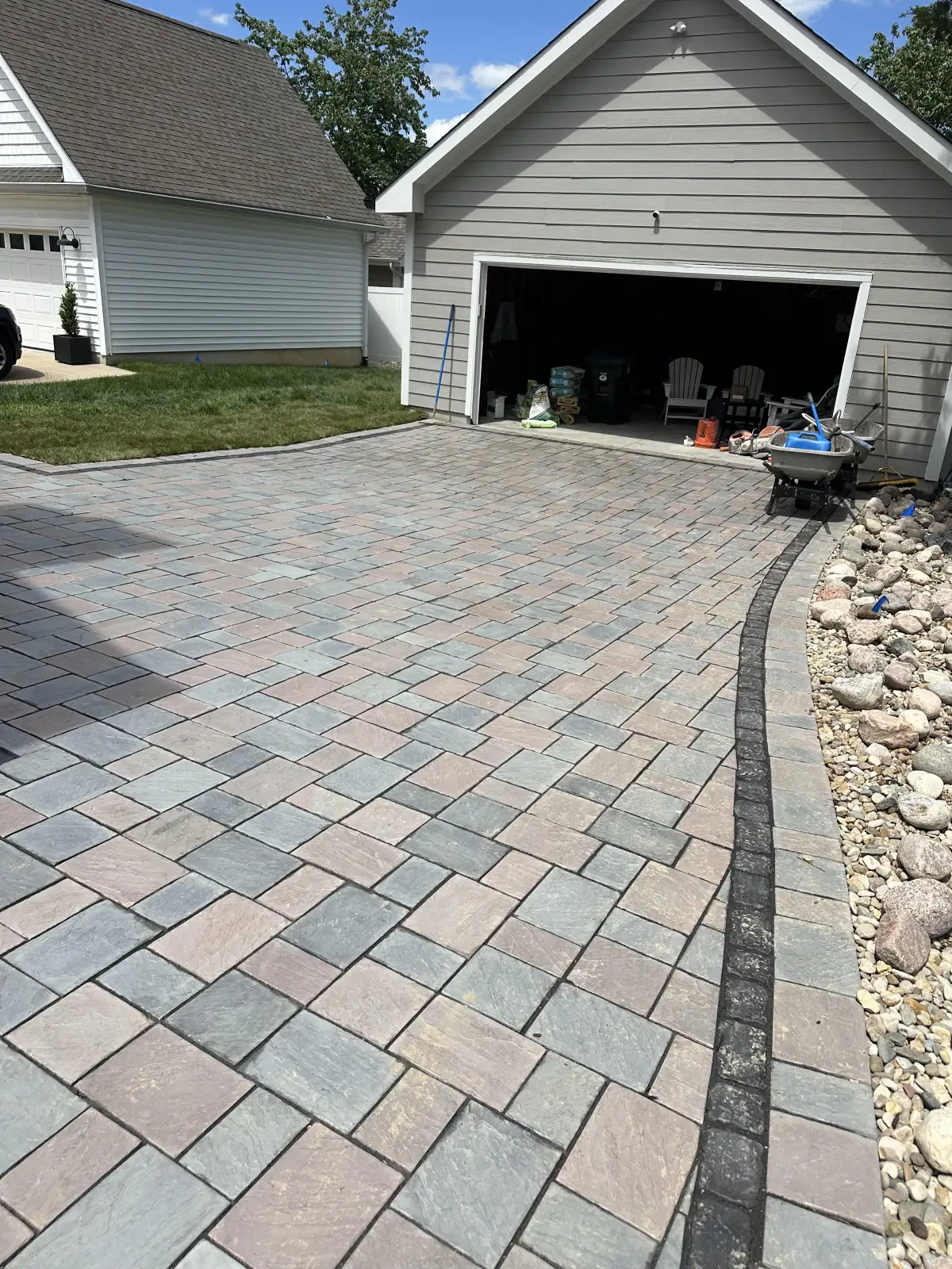 Multicolor paver patio with rock border installed by Green Operations in St. Louis