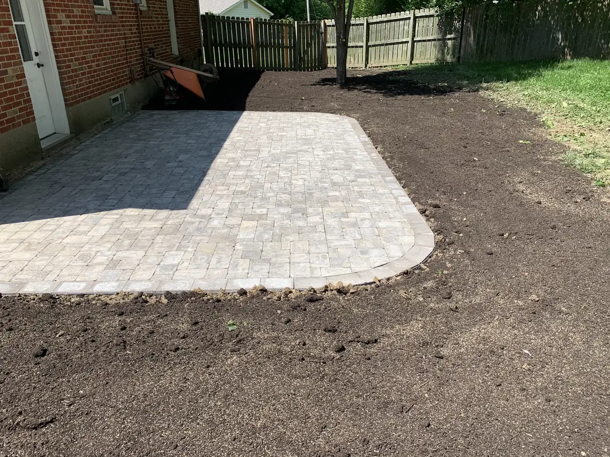Finished paver patio and landscaped backyard by Green Operations