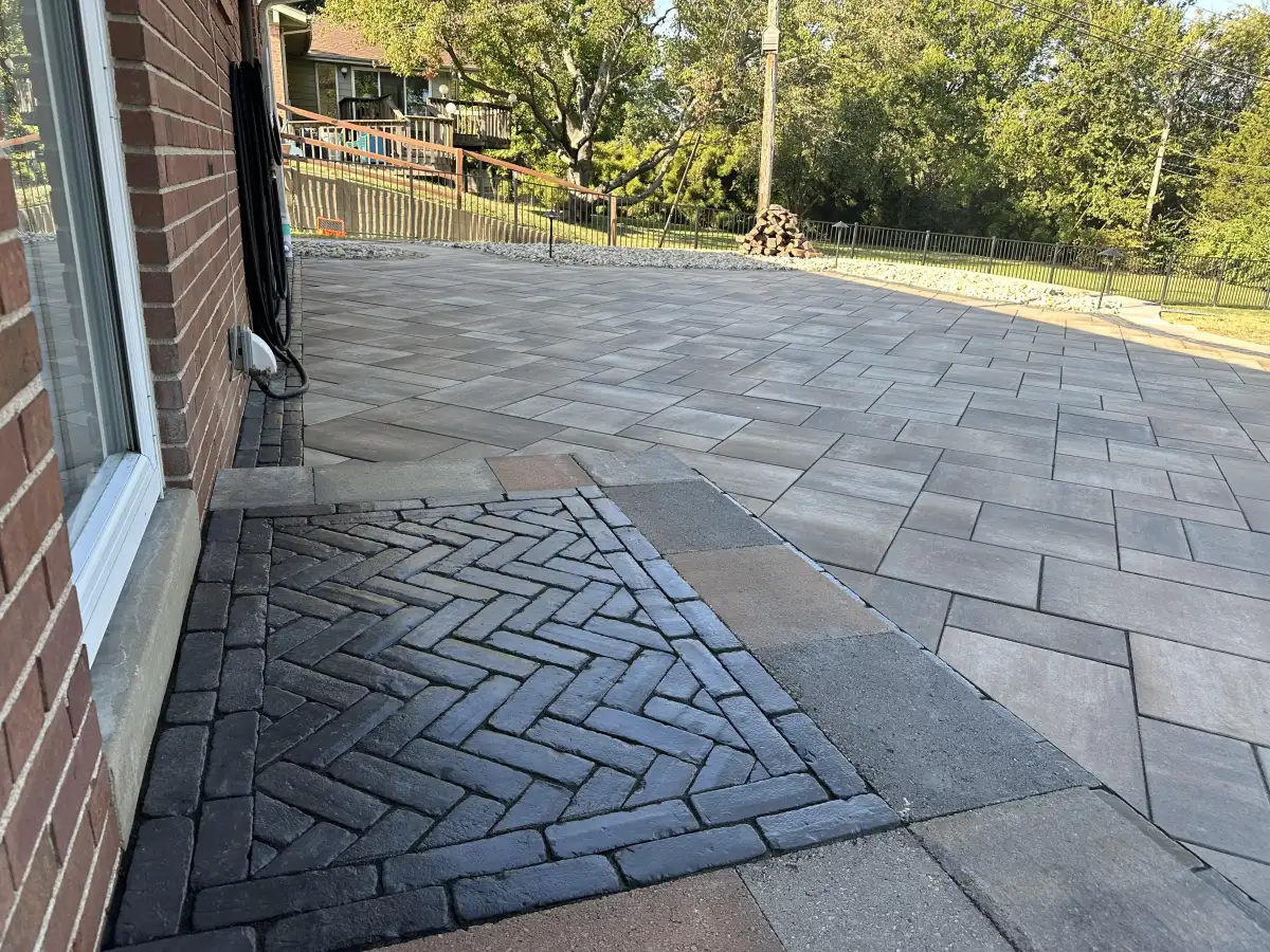Paver patio with herringbone brick inset detail in St. Louis backyard