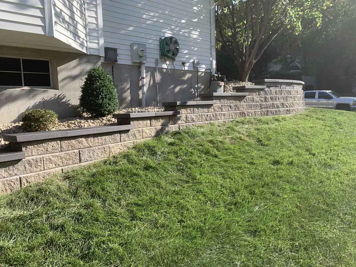 Tiered retaining wall with steps and landscaping