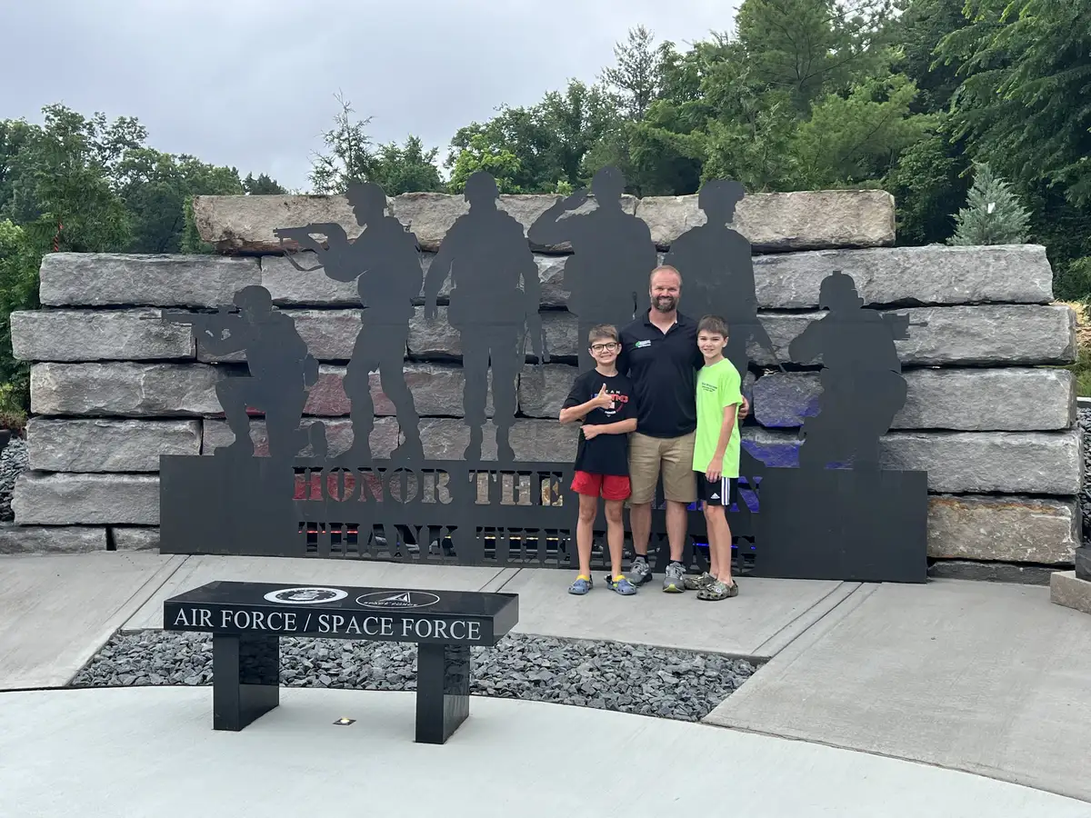 Travis, owner of Green Operations, with his family at a community event